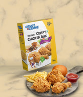 Box of Crust N Crumb Instant Crispy Chicken Mix with fried chicken, fries, and ketchup on a stone board.
